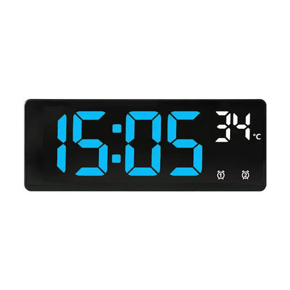 Digital clock with blue LED display on a white background