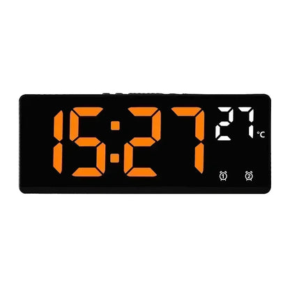 Digital clock with orange digits on a black background
