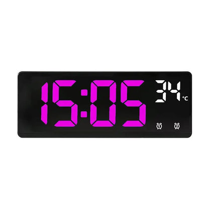 Digital clock with pink digital display on a white background