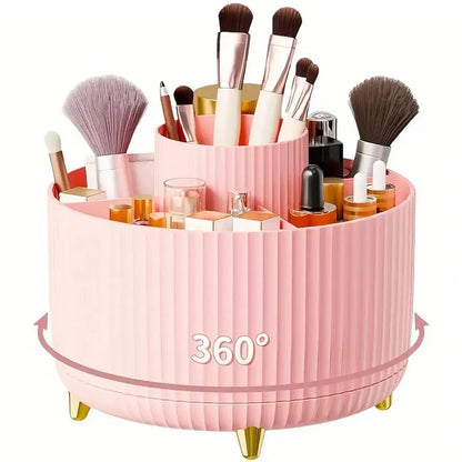 Pink 360-degree rotating makeup organizer with brushes and products on a white background