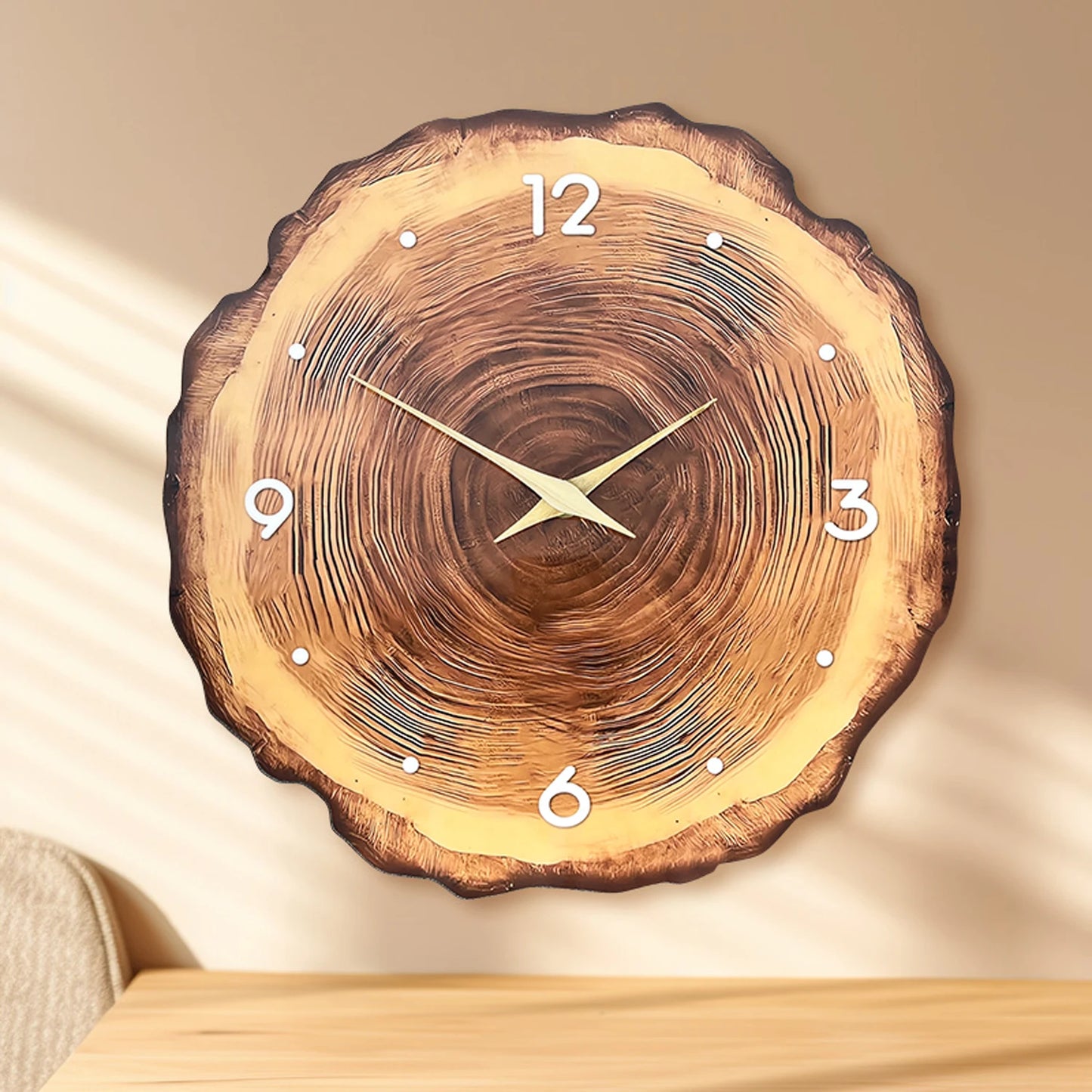 Wooden wall clock with tree ring design on a beige background