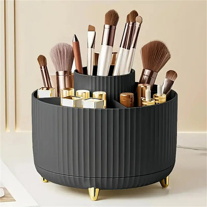 Black cosmetic organizer with makeup brushes and products on a light background