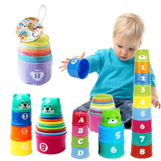 Colorful stackable cups with numbers and letters, with a child playing with them.