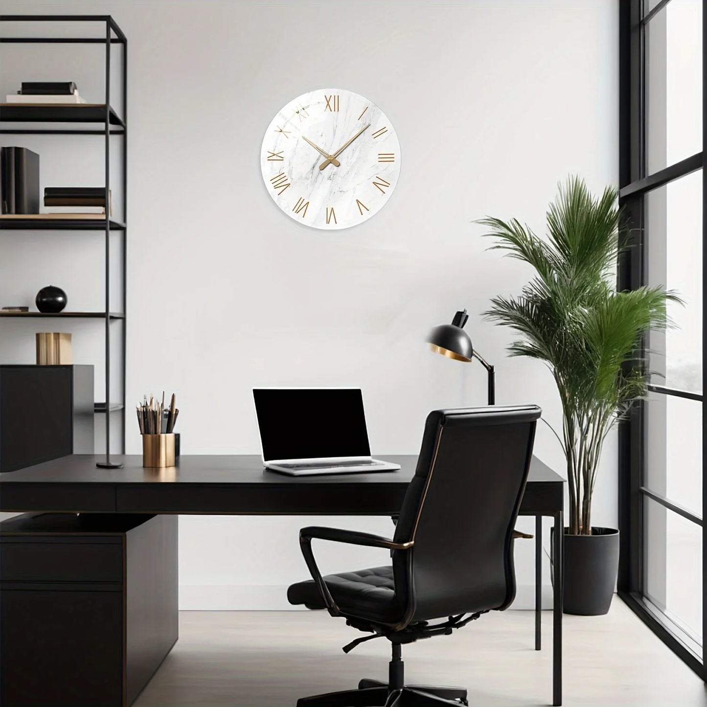 Modern office setup with a desk, chair, laptop, and decorative clock on the wall.