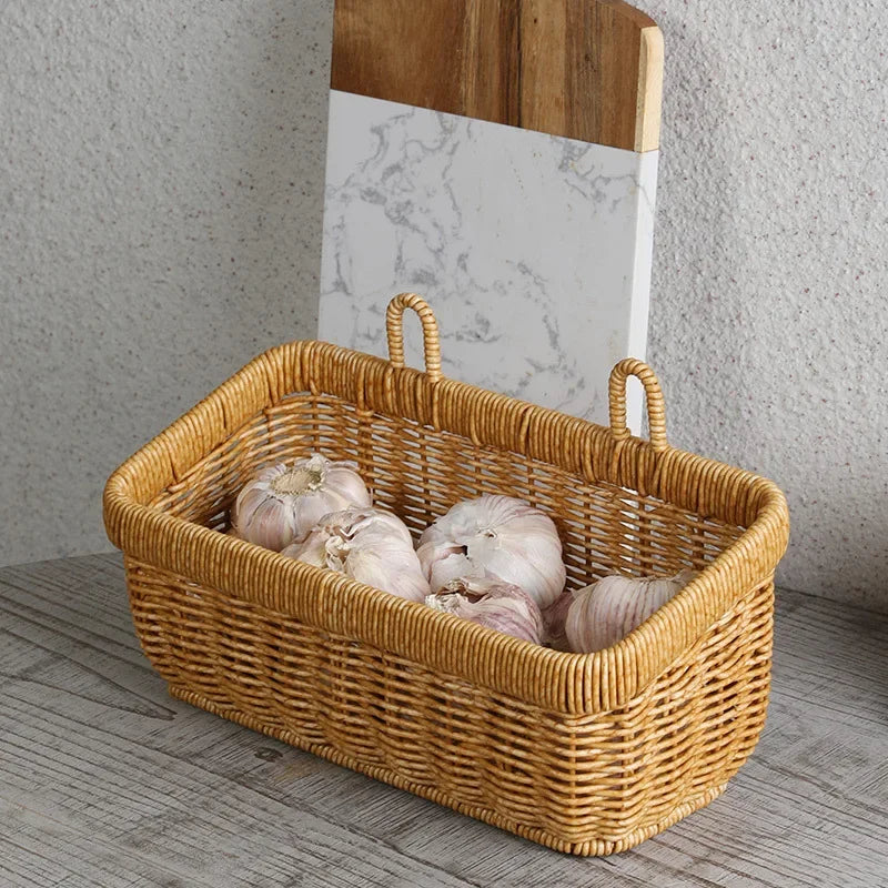 Wicker basket with garlic on a wooden surface
