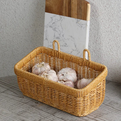 Wicker basket with garlic on a wooden surface