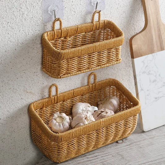 Two wicker wall baskets hanging on a textured wall with a neutral background.
